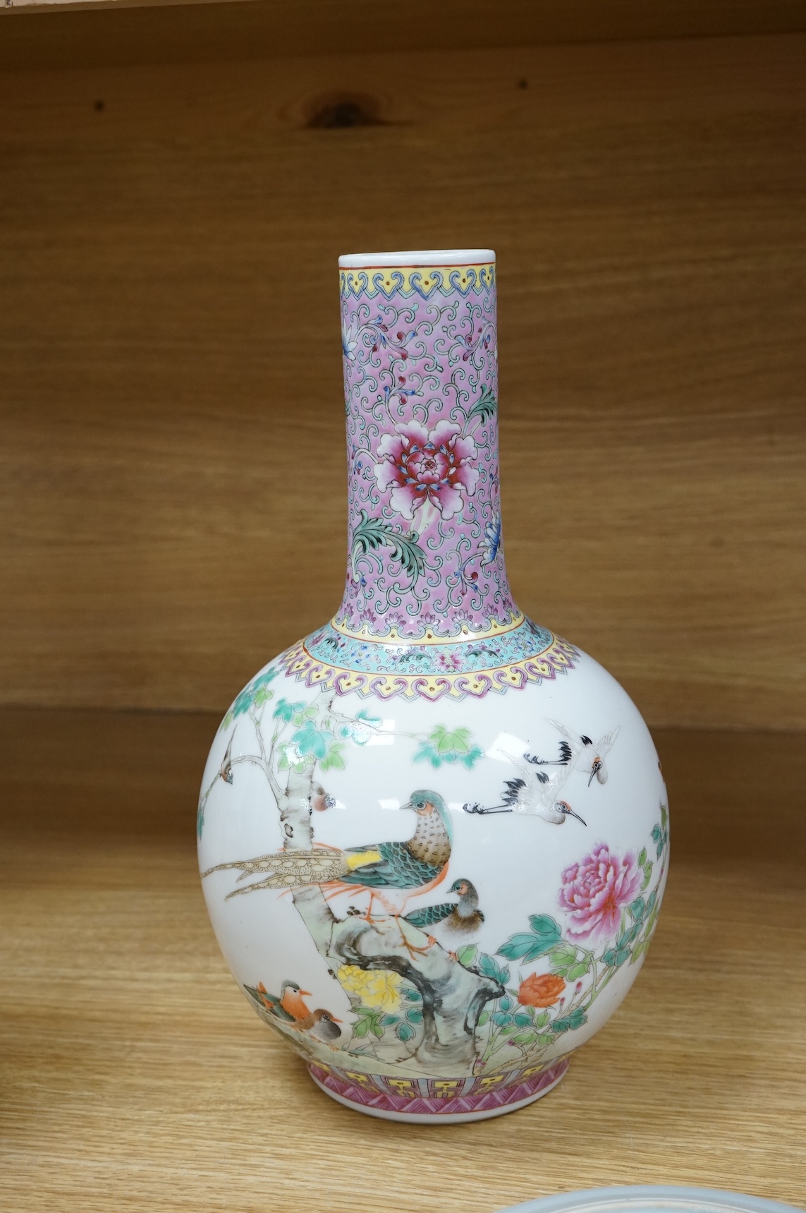 A Chinese famille rose vase, mid 20th century and a Chinese blue and white ‘boys’ dish, c.1900, vase 33cm high